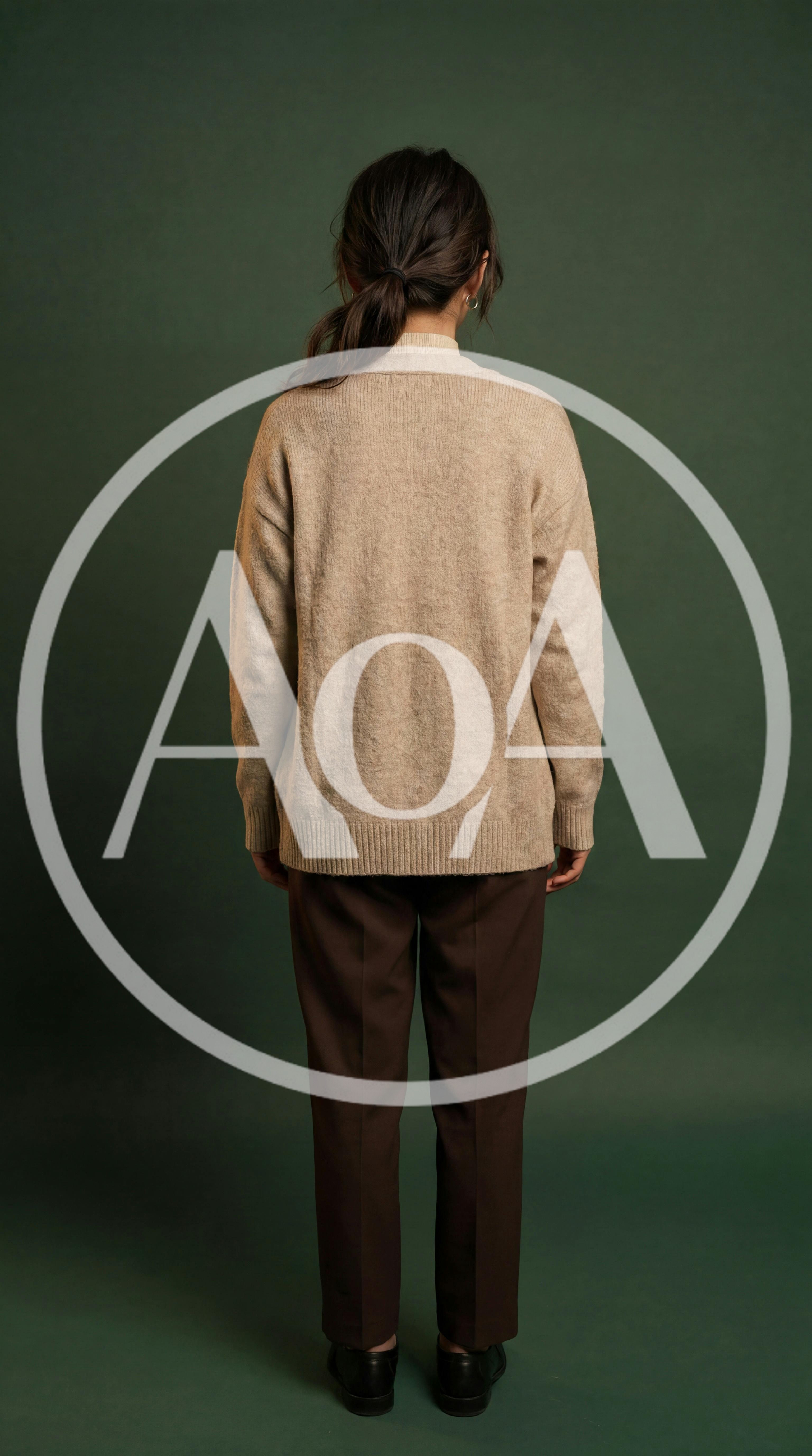 Woman Standing Back View In Beige Cardigan And Trousers