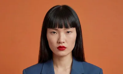 Portrait Of A Professional Asian Woman In A Blue Blazer