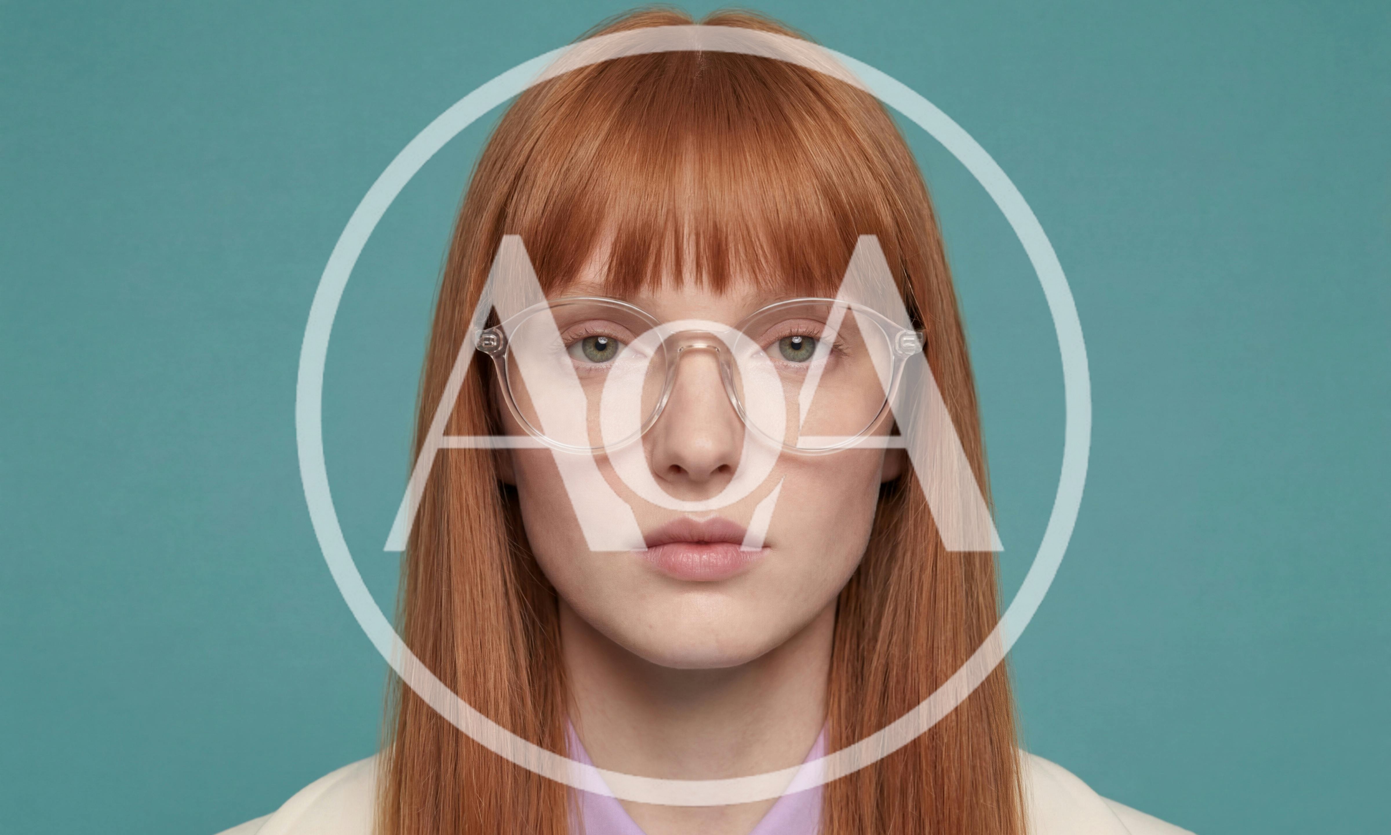 Portrait Of A Young Woman With Red Hair And Glasses