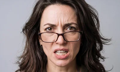 Angry Woman With Glasses Looking At Camera