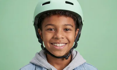 Smiling Young Boy Wearing A Protective Helmet