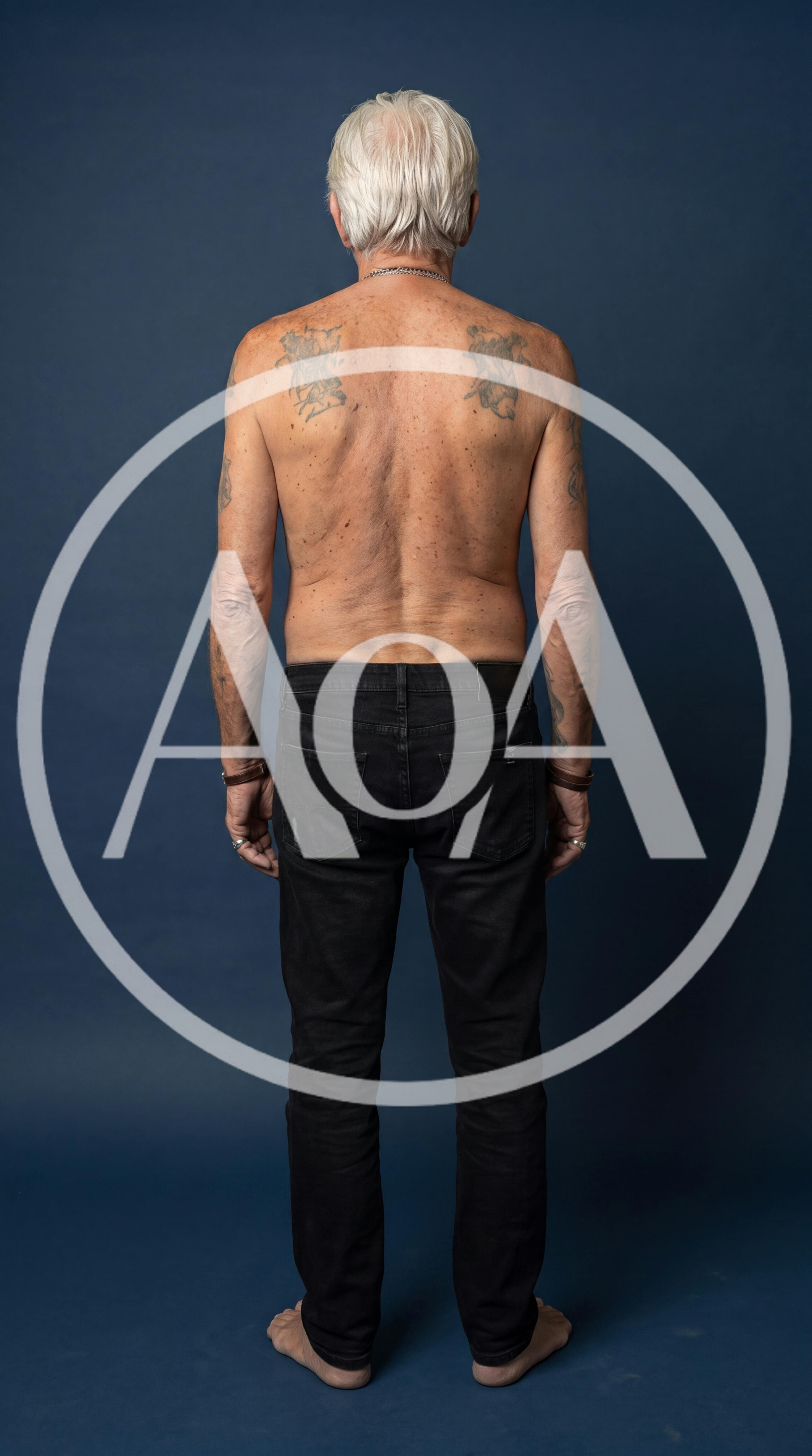 Back View Of An Older Man With Tattoos