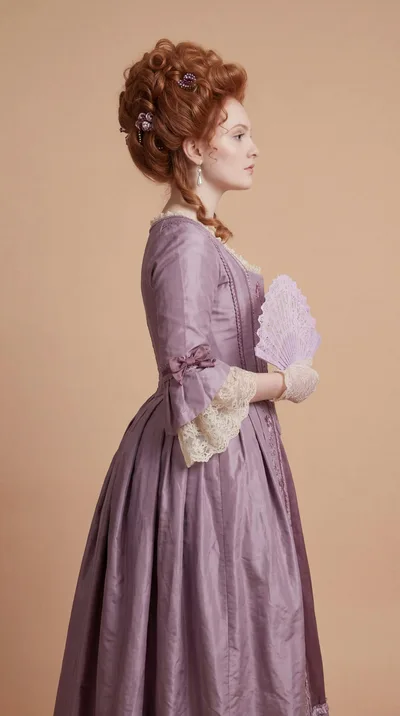 Woman In Historical 18th Century Purple Dress With Fan