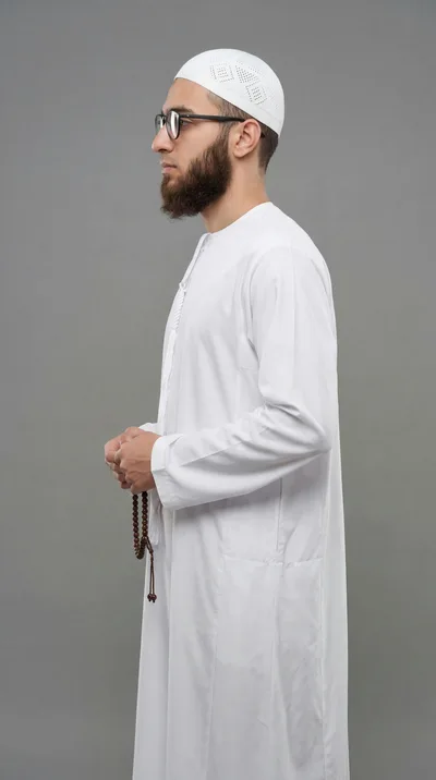 Muslim Man Holding Prayer Beads in Profile