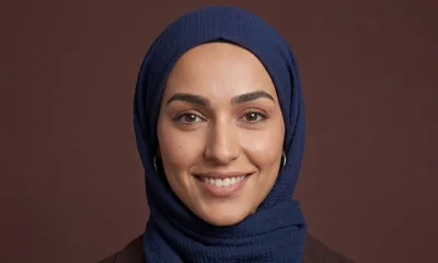 Portrait Of A Smiling Woman Wearing A Blue Hijab