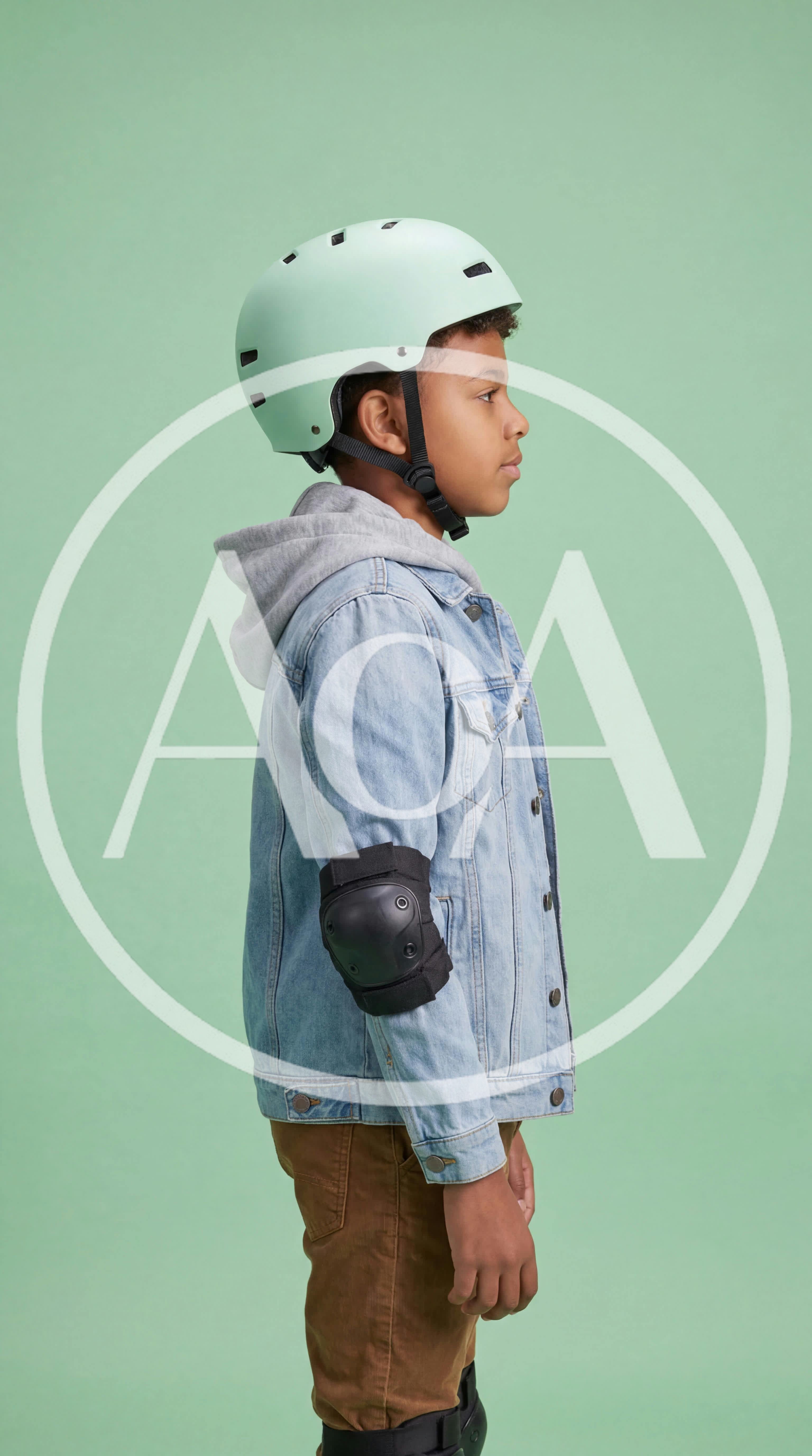 Young Boy Wearing Protective Gear For Skating