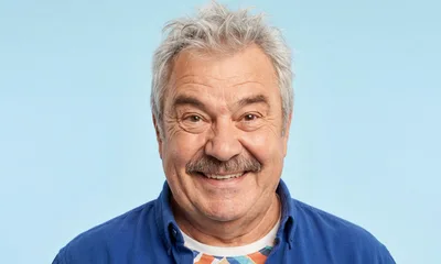 Portrait Of A Smiling Senior Man With A Mustache