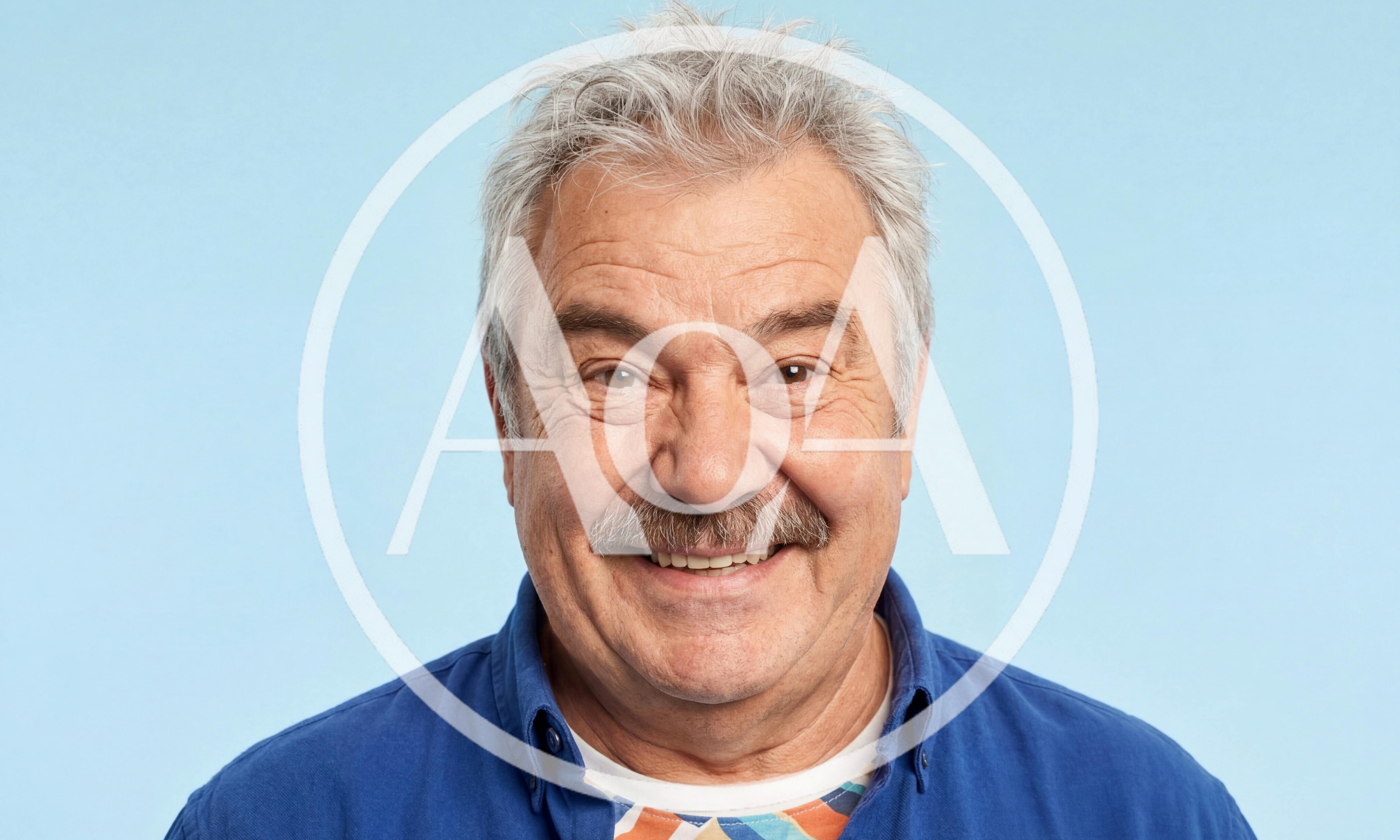 Portrait Of A Smiling Senior Man With A Mustache
