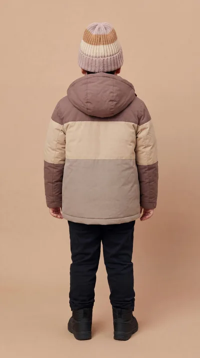 Young Boy Wearing Winter Jacket and Beanie