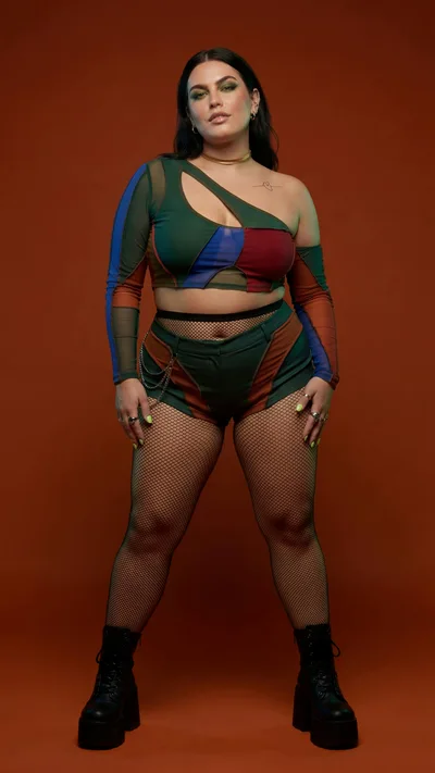 Plus Size Fashion Model Posing In Colorful Patchwork Outfit