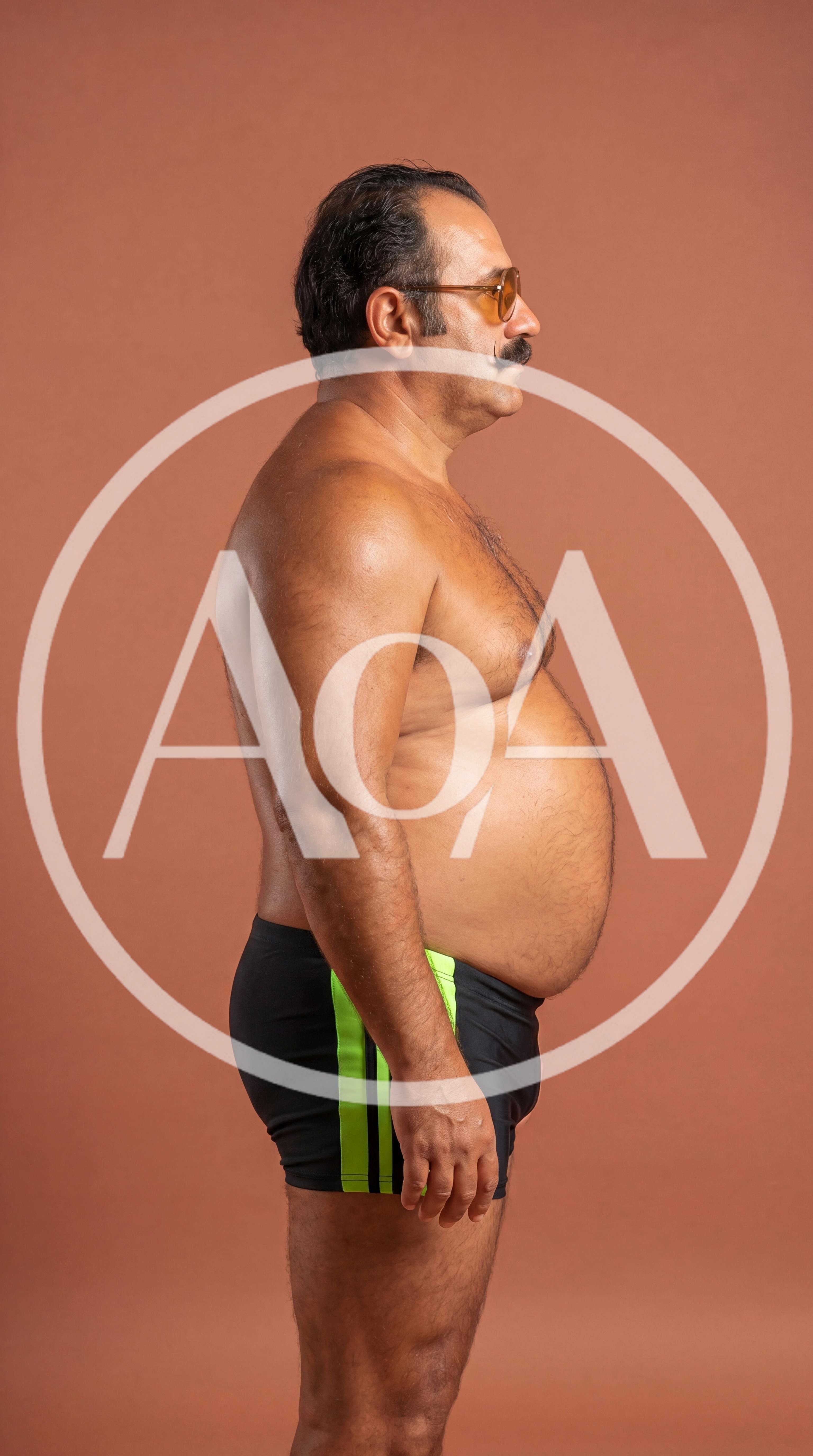 Middle Aged Man Standing In Swim Trunks