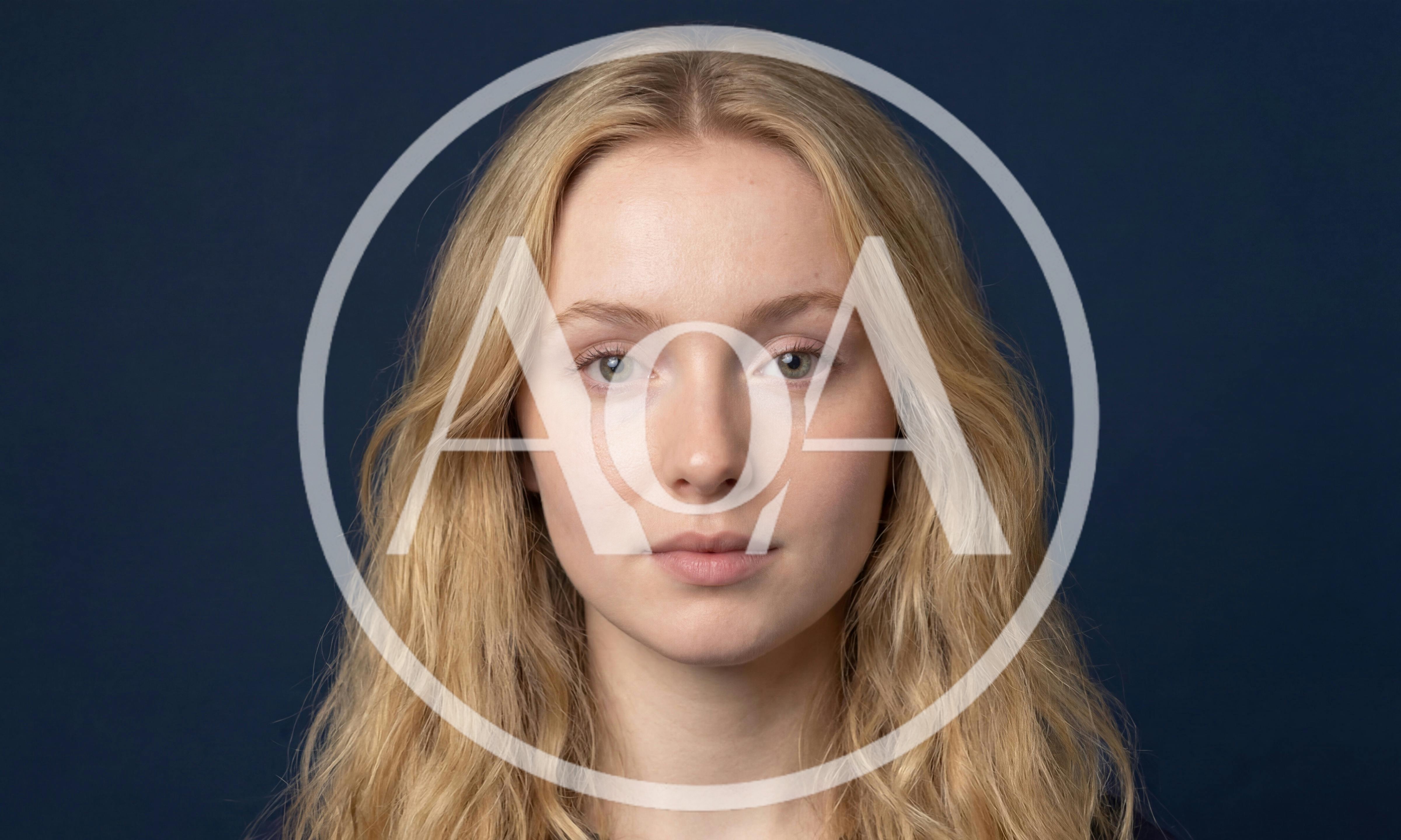 Portrait Of A Young Blonde Woman Looking At Camera