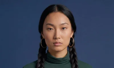 Portrait Of A Young Asian Woman With Braided Hair