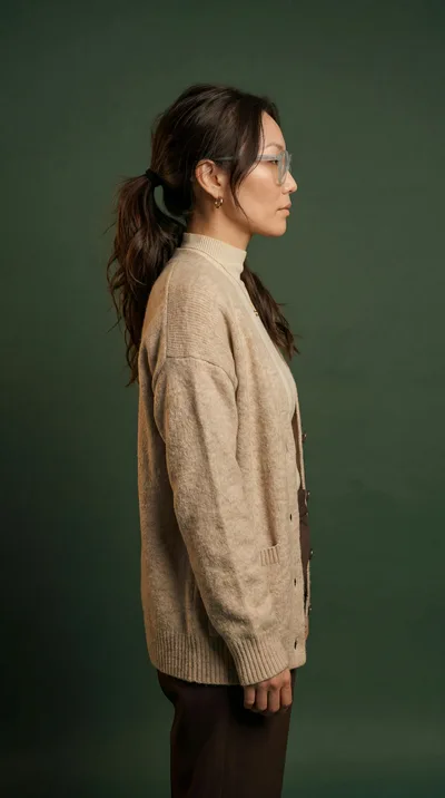 Side Profile Of A Woman In A Beige Cardigan