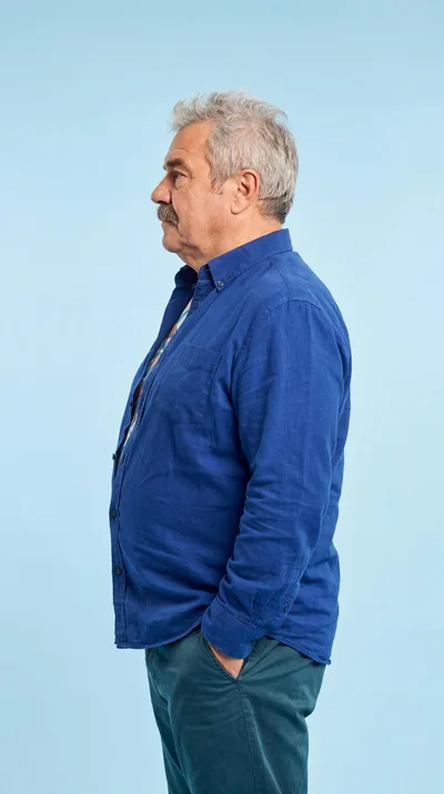 Side Profile Of A Senior Man In A Blue Shirt