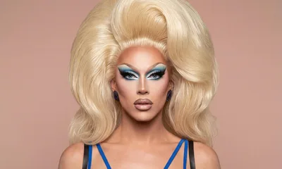 Drag Queen With Blonde Hair And Blue Makeup