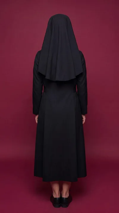 Back View Of A Nun Standing Against A Maroon Background