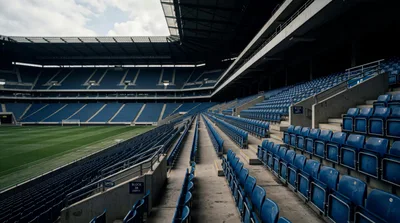 Empty Blue Stadium Seats At A Professional Football Arena