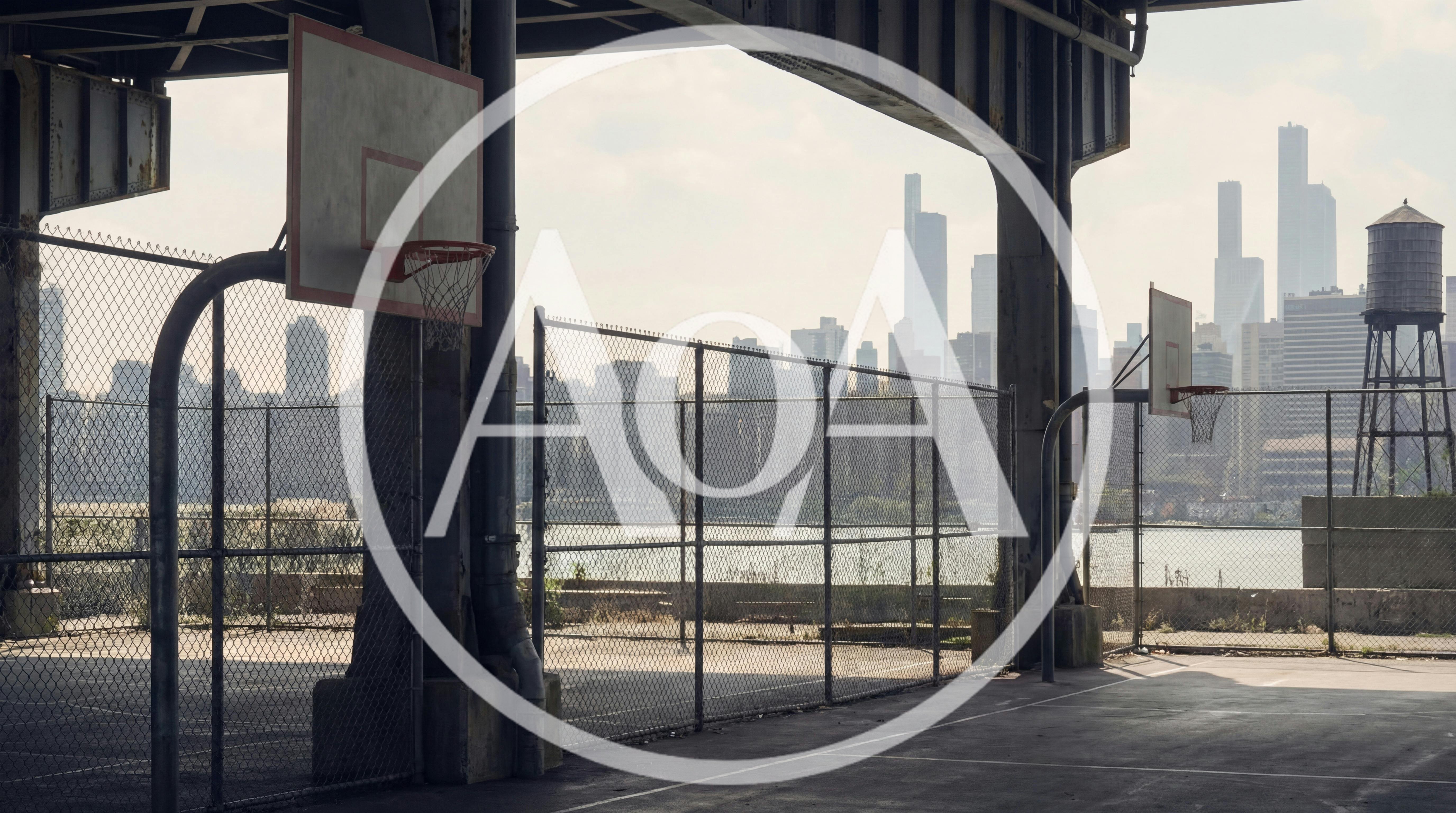 Urban Basketball Court Under Bridge With City Skyline