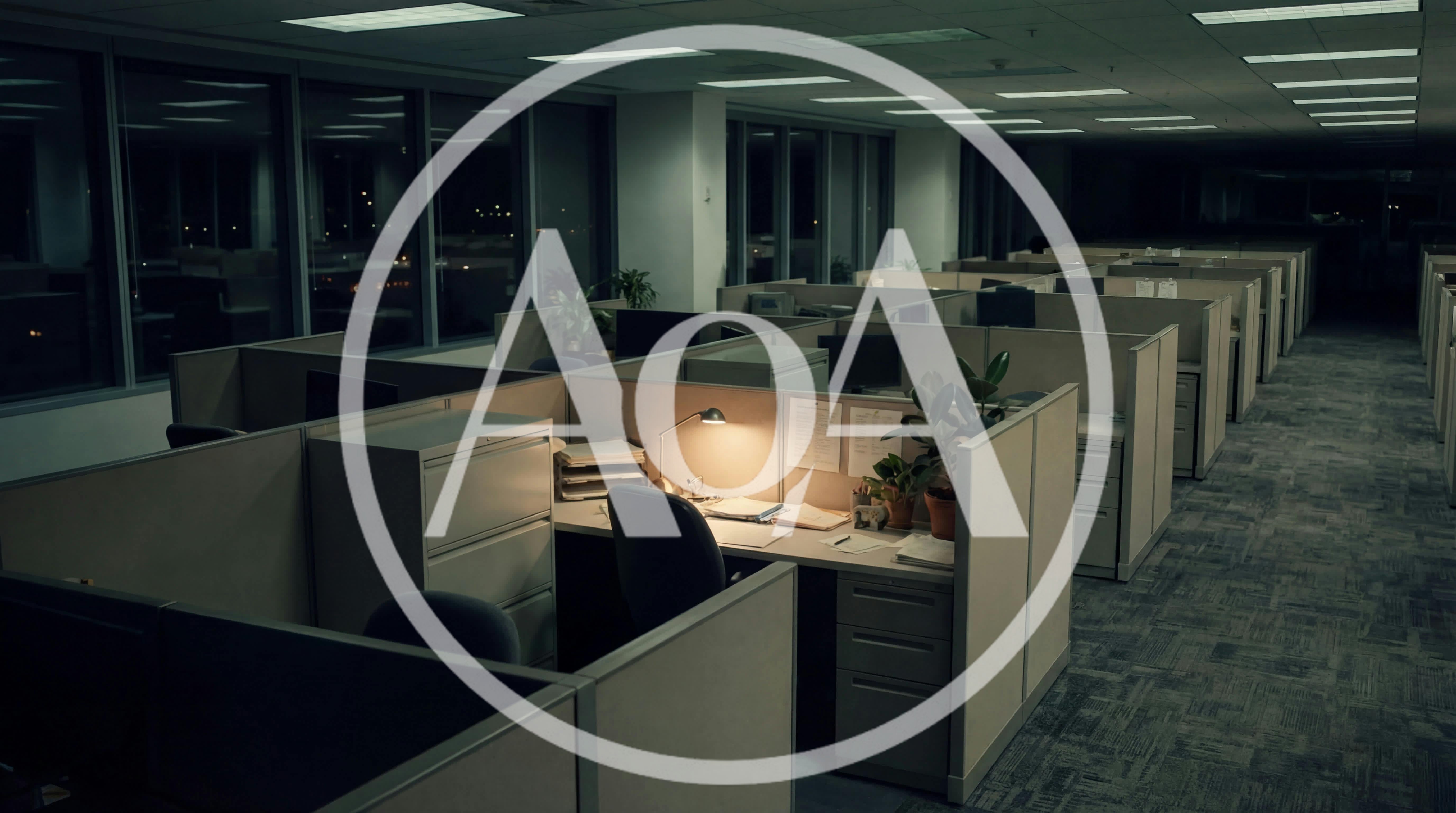 Empty Office Cubicles At Night With Desk Lamp