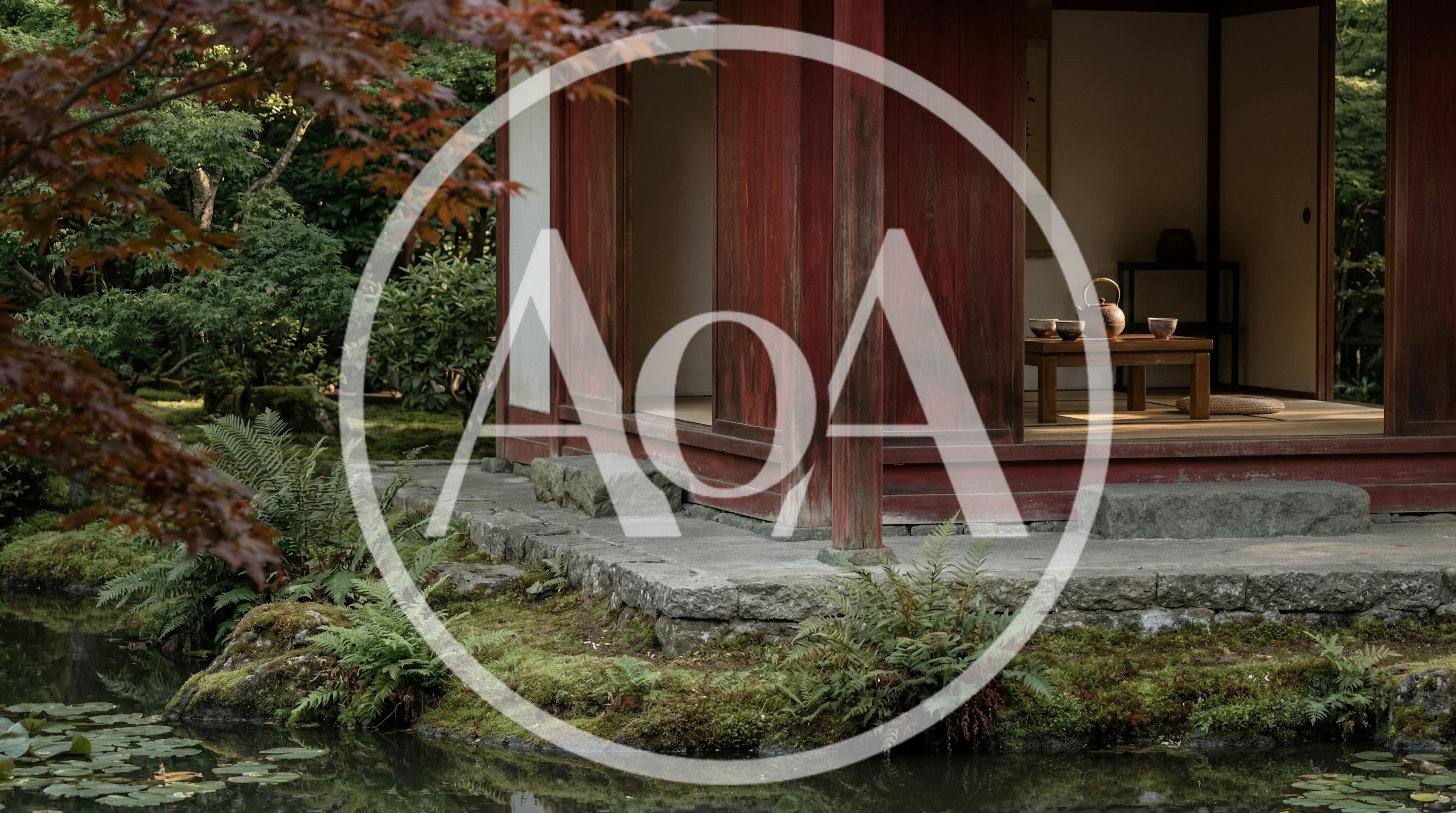 Traditional Japanese Tea House Beside A Tranquil Garden Pond
