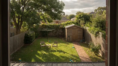 Backyard Garden View With Wooden Shed And Chairs