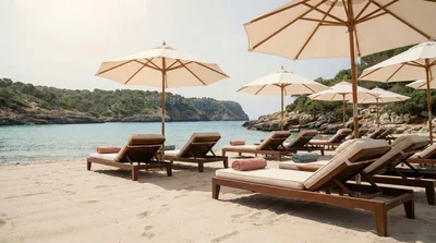 Empty Sun Loungers On A Tropical Beach