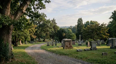 Gravel Path Winding Through A Peaceful Historic Cemetery