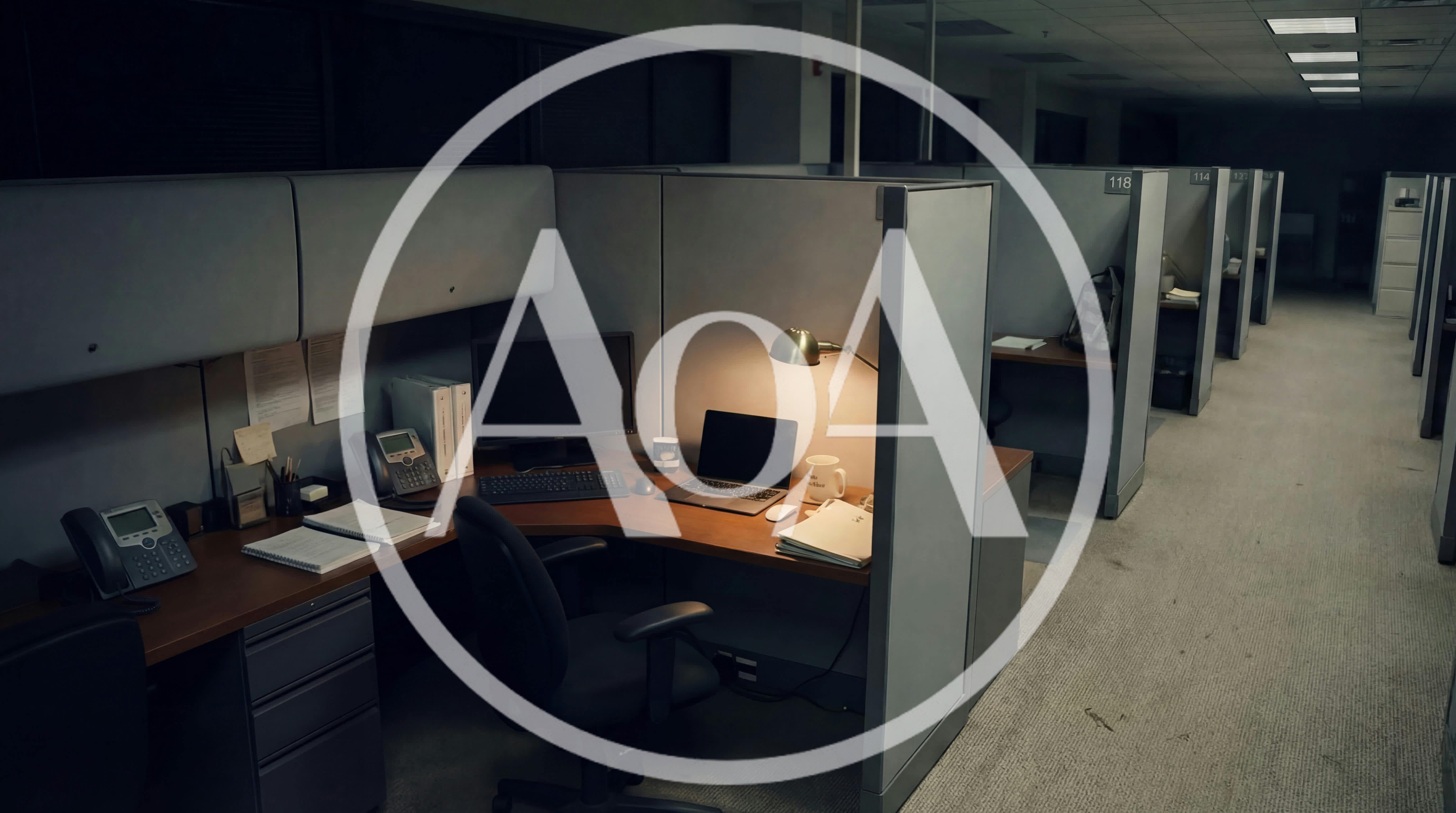 Empty Office Cubicles In A Dimly Lit Workplace