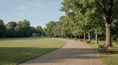 Empty Park Path With Benches And Classical Monument