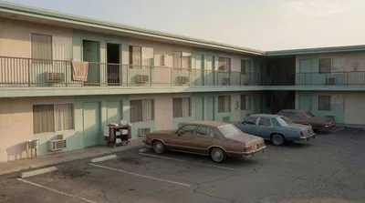 Vintage Motel Exterior With Parked Classic Cars