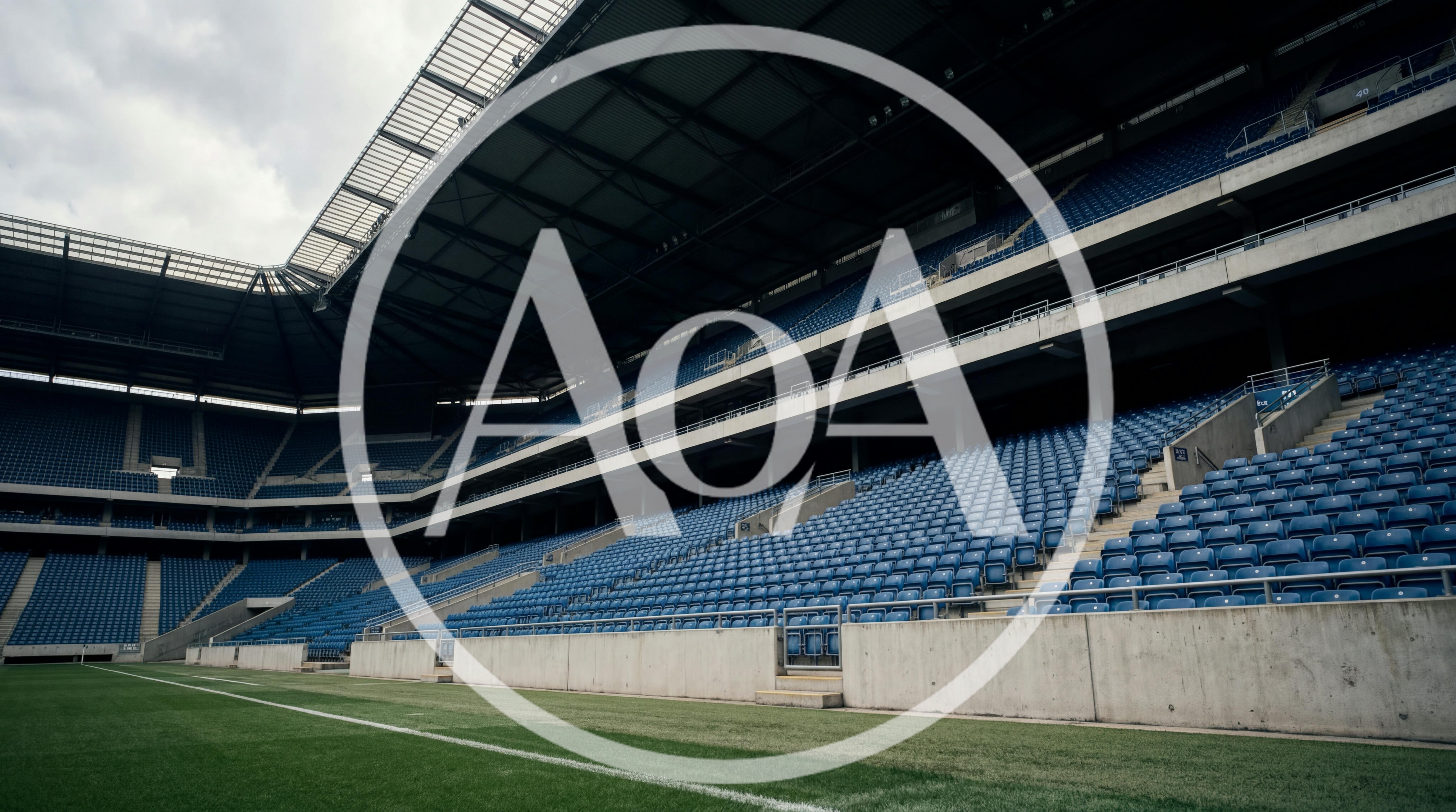 Empty Blue Stadium Seats Under Large Roof