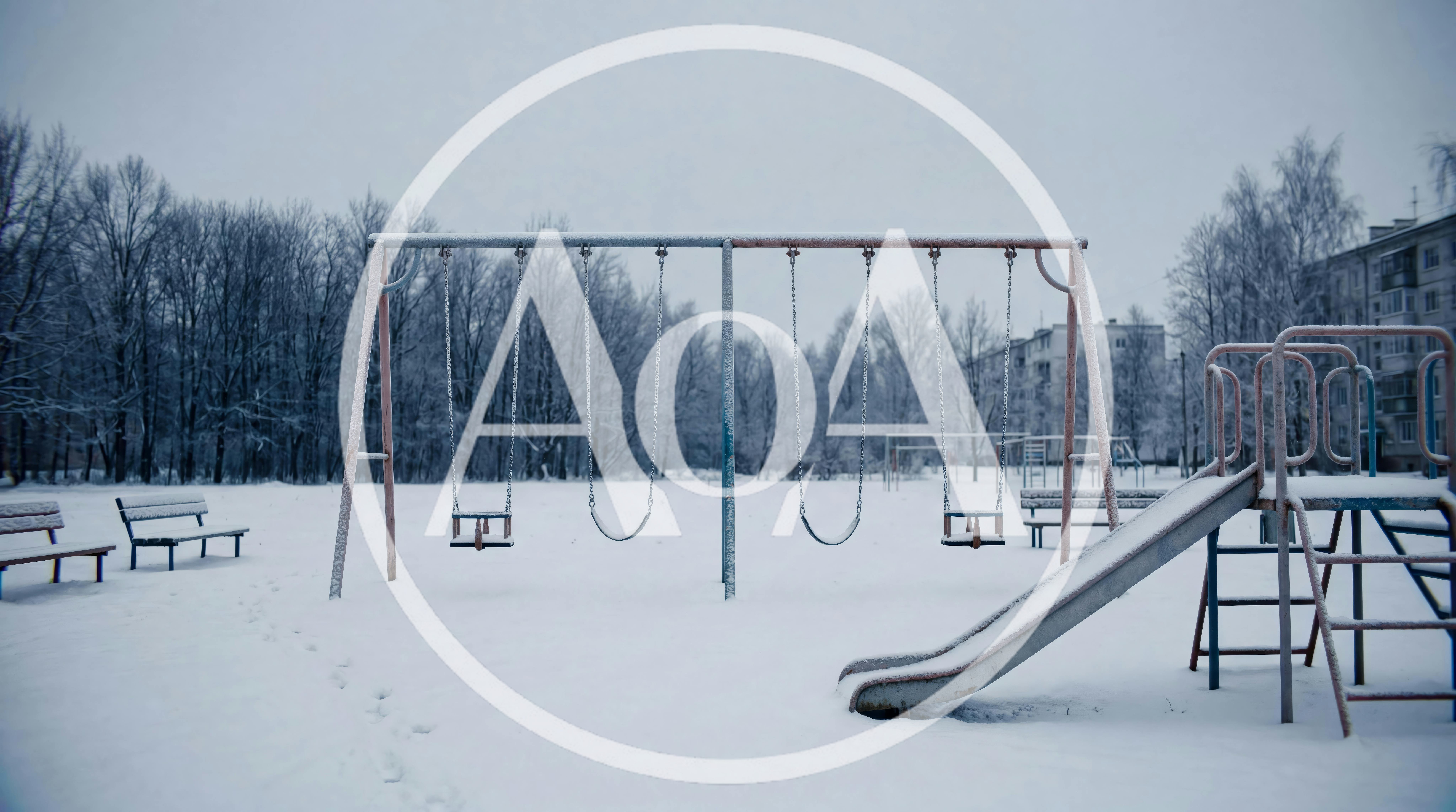 Empty Playground Swings In A Snowy Winter Park