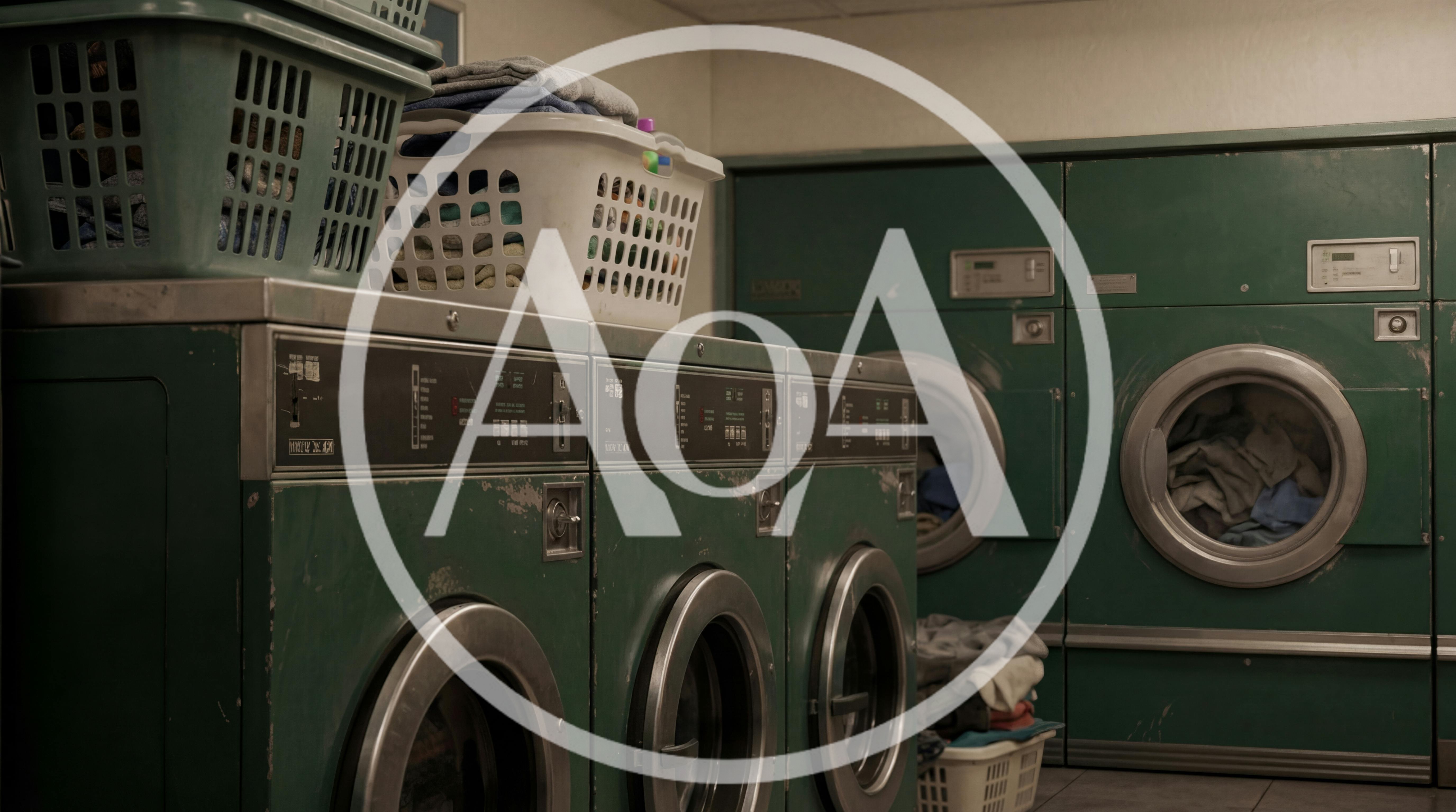 Vintage Green Industrial Washing Machines In A Laundromat