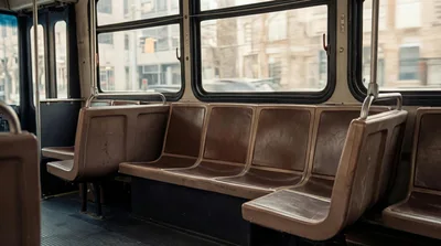 Empty Brown Seats Inside A Public Transit Bus