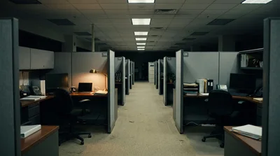 Empty Office Cubicles In A Dimly Lit Corporate Workspace