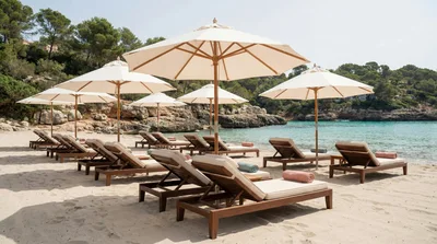 Empty Beach Lounge Chairs Under Umbrellas