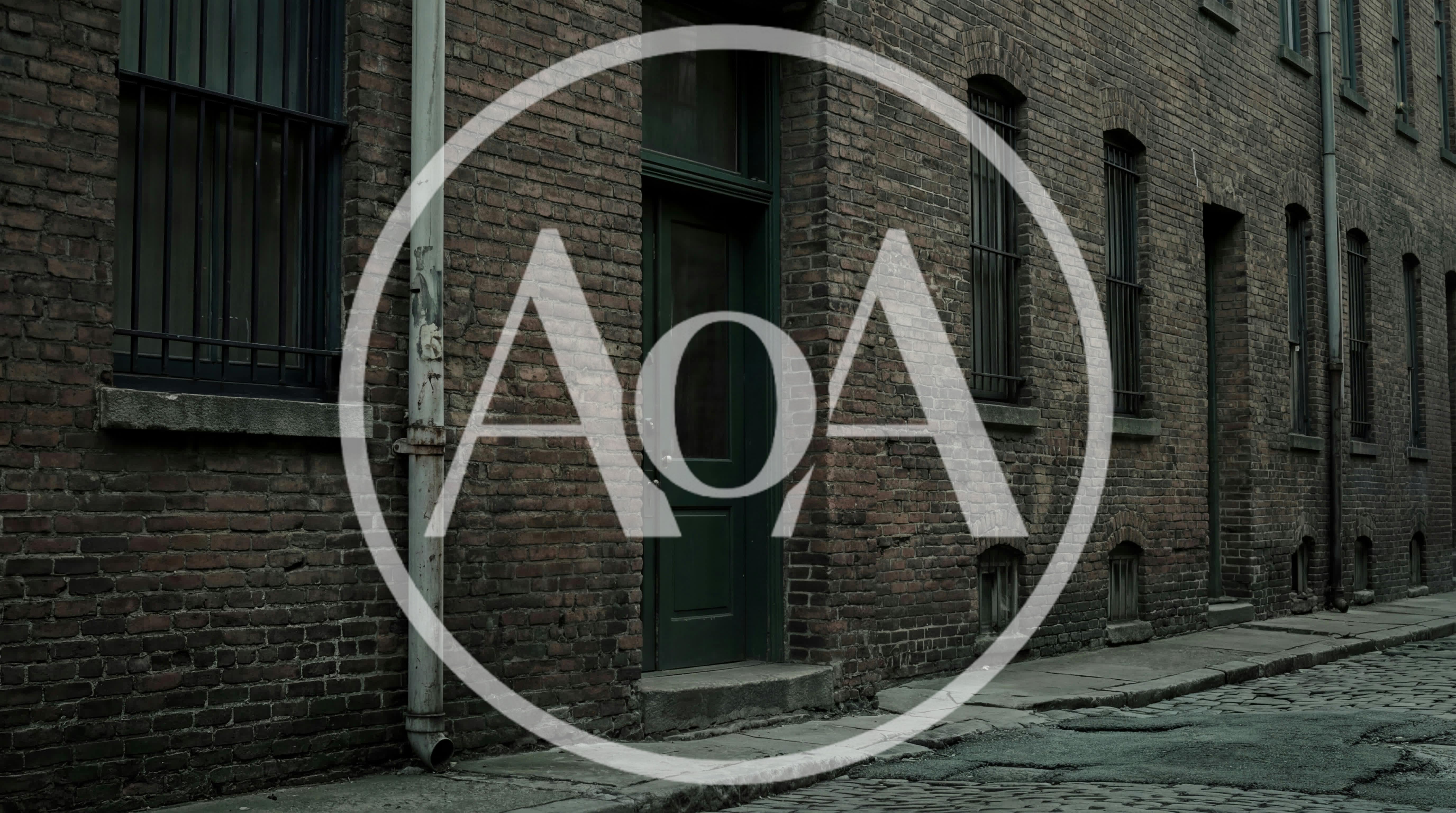 Old Brick Building Exterior On A Cobblestone Street
