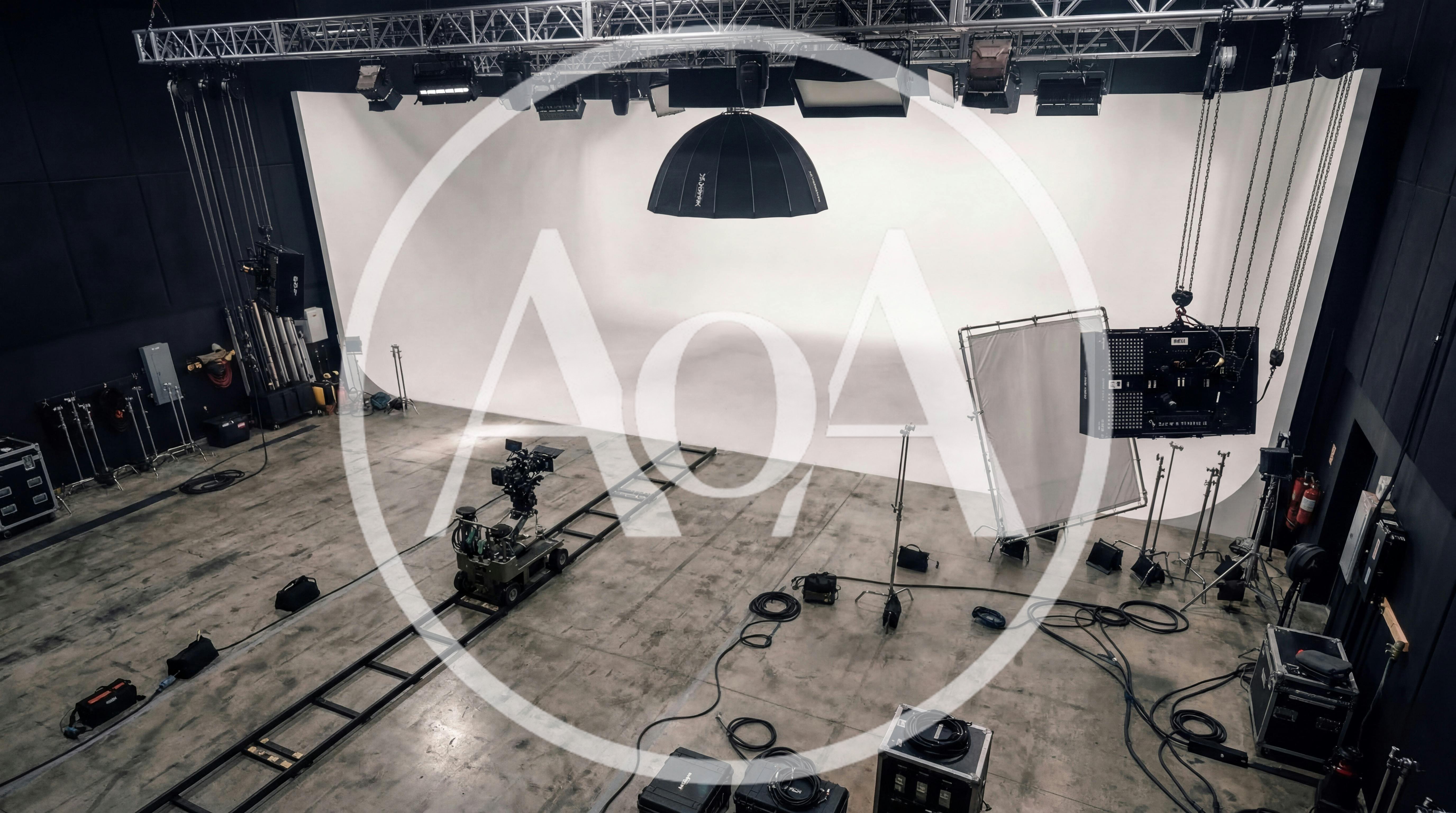 Empty Film Studio With Camera Dolly And Lighting Equipment
