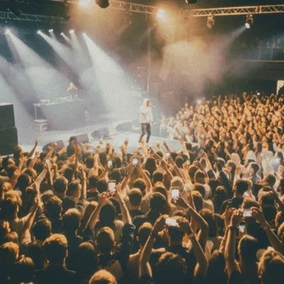 Rapper Performing On Stage At A Crowded Music Concert