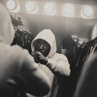 Young Man Boxing In Front Of A Mirror