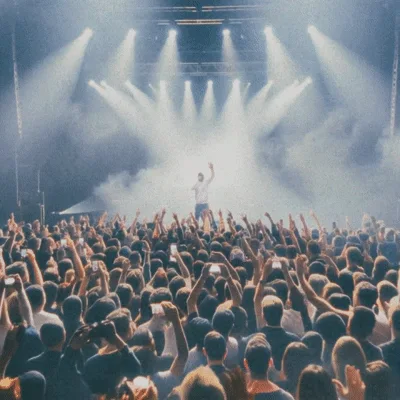 Rapper Performing On Stage Before A Large Crowd