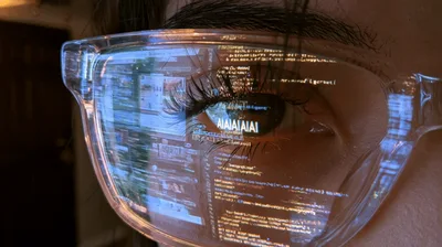 Close Up Of Eye Reflecting Computer Code