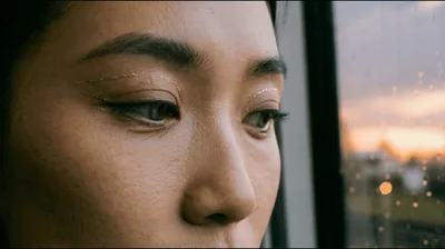 Close Up Of A Woman Looking Out A Train Window