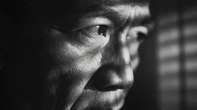 Close Up Portrait Of An Asian Man Looking Away