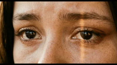 Close Up Of A Young Woman Opening Her Eyes