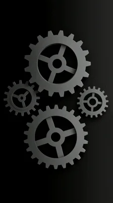 Four Interlocking Grey Gears Rotating In Synchronized Motion