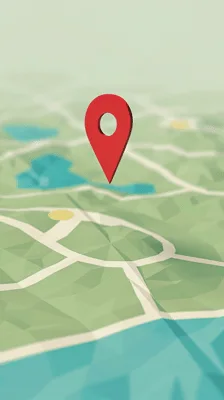 Red Map Pin Floating Above Low Poly Terrain