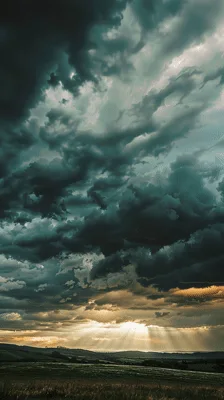 Dramatic Storm Clouds Over Rolling Green Hills