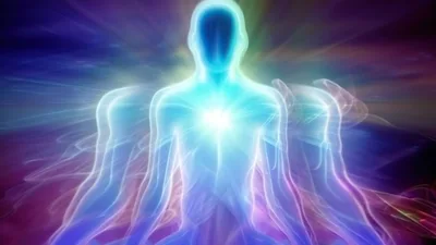 Abstract Human Silhouette Meditating With Radiant Energy Aura